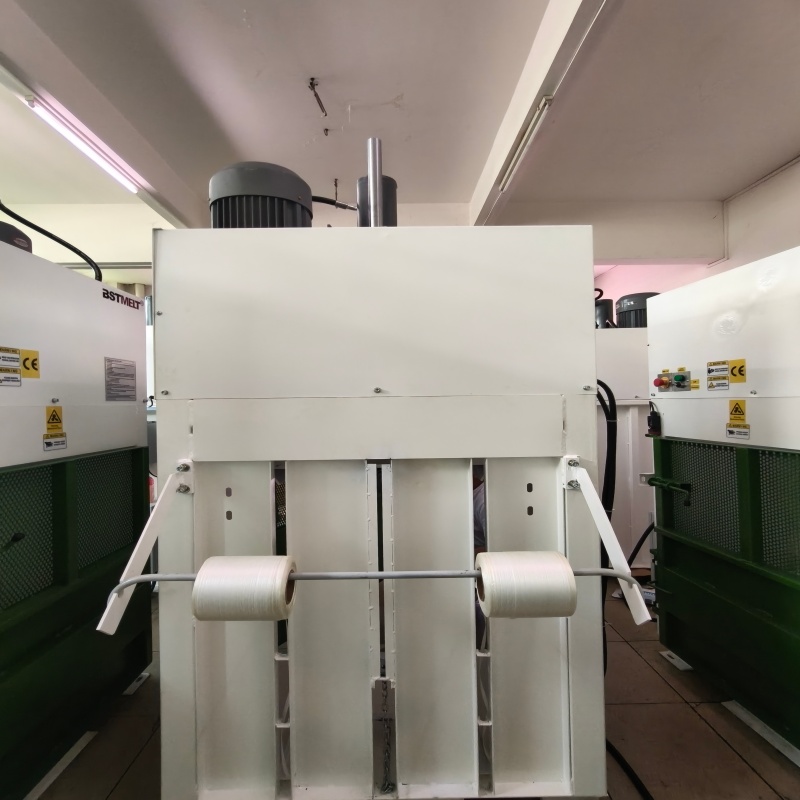 Baling Press Strap In Cardboard Bundling